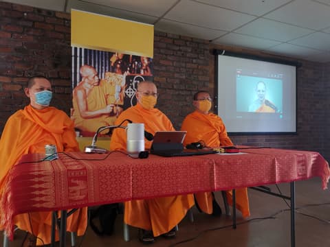 Monks giving a Dhamma talk