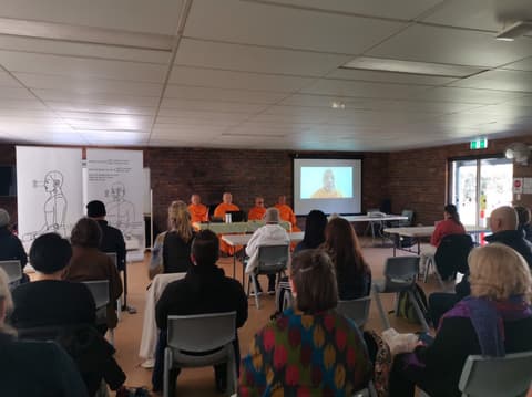 Monks leading a session, with a teacher joining on screen