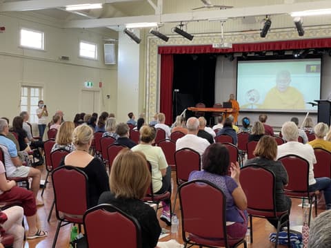 Guests seated for a public meditation session