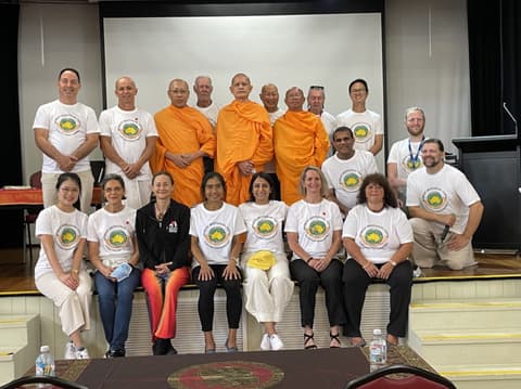 Volunteers and monks in a group photo